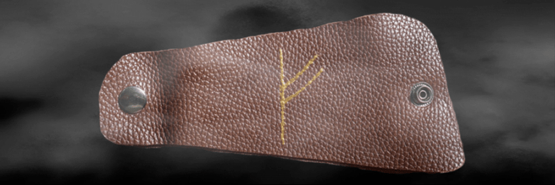 Руна Феху на коже как счастливый амулет